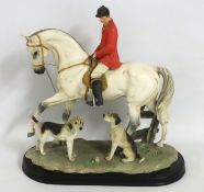 A large resin figure of huntsman with horse & houn