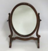A small Edwardian mahogany framed oval dressing ta