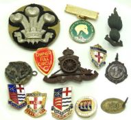 A small selection of badges including military & b
