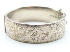 A 1964 Georg Jensen silver bangle with chased deco