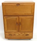 An Ercol elm drinks cabinet, 1100mm high x 820mm w