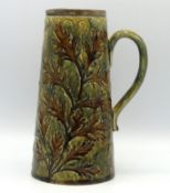 A Doulton stoneware jug with leaf pattern fitted w