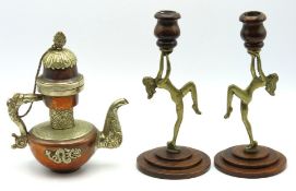 A pair of oak mounted art deco candleholders, one