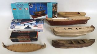 Four unfinished model boats, a model makers boxed