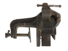 A small table vice stamped 661, main body 158mm wi