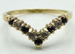 A 9ct gold wishbone ring set with sapphire & paste