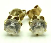 A pair of 9ct gold earrings set with paste stones,