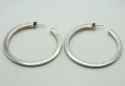 A pair of silver hoop earrings, 50.75mm wide, 9.6g