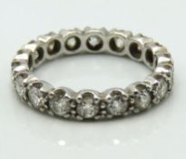 A 1920s white metal eternity ring set with approx.