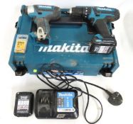 A Makita CLX202AJ combi drill kit containing two d