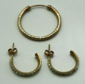 A pair of 9ct gold earrings set with paste stones,