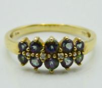 A 9ct gold ring set with two small diamonds & colo