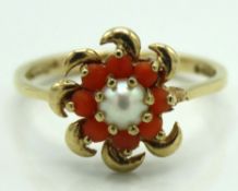 A 9ct gold ring set with red coral & pearl, lackin
