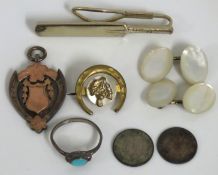 A silver rugby union sporting medallion with rose