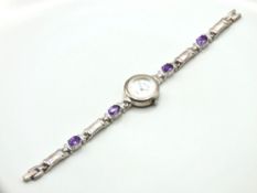 A ladies silver wristwatch set with amethyst with