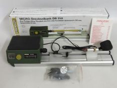 A boxed Proxxon DB250 Micro Wood turning lathe, pr