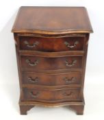 A mahogany serpentine fronted bedside chest of fou