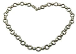 A silver chain with circular links, 410mm long, 36