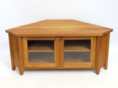A modern oak corner television stand, 1250mm wide