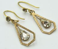 A pair of 9ct gold drop earrings set with paste st