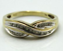 A 9ct gold ring set with fourteen small diamonds,