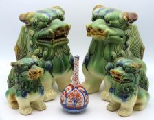 Two Chinese foo dogs with smaller matching foo dog