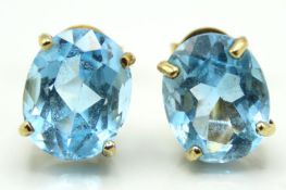 A pair of 9ct gold mounted topaz earrings, 10mm at