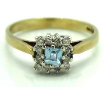A 9ct gold ring set with aquamarine & approx. 0.12