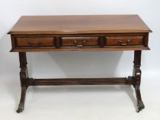 A reproduction Regency style sofa table with three