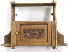 An Edwardian arts and crafts style hanging wall sh