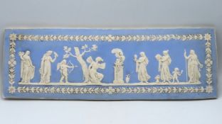 An early 19thC. Wedgwood jasperware wall plaque wi
