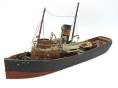 A vintage model of a Port of London tug boat 