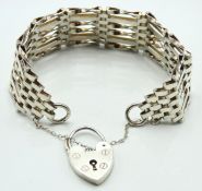 A silver six bar gate bracelet with padlock, 21.8g
