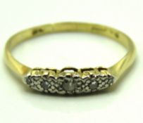 An 18ct gold ring with platinum set diamonds of ap