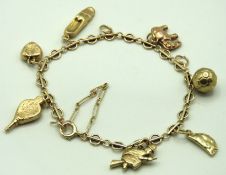 A 9ct gold charm bracelet with bellows, pasty & fo