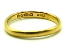 A 22ct gold band, some misshaping, 3.2g, size O