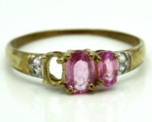 A 9ct gold ring set with pink sapphire & diamond,