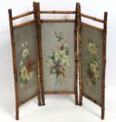 An early 20thC. bamboo & tin fire screen, 845mm wi