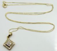 A 9ct gold chain with pendant set with approx. 0.2