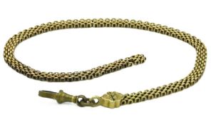 An antique yellow metal chain with enamelled detai