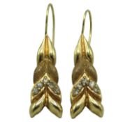 A pair of 14ct gold earrings of organic form set w