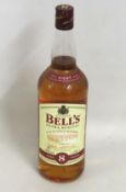 A bottle of Extra Special Bells 8 year old whisky,