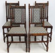 A set of four upholstered Edwardian oak dining cha