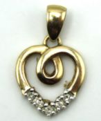 A 9ct gold heart shaped pendant set with 0.1ct dia
