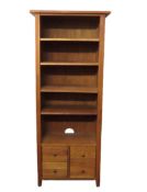 A tall oak bookcase with drawers under, 760mm wide