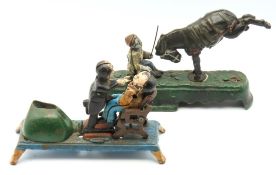 Two late 19thC. coin operated mechanical money ban