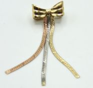 A 9ct gold tri-colour bow shaped brooch, 42mm drop