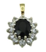 A 9ct gold sapphire & white stone pendant, 19mm dr