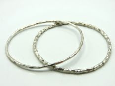 Two silver bangles, internal measurements 72mm wid