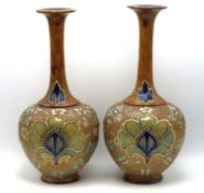 A pair of Royal Doulton stoneware vases, one a/f,